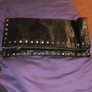 Large black clutch with gold studs